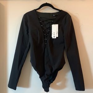 Black long sleeve plunging body suit